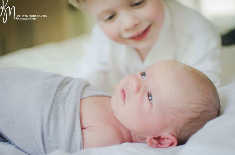 Newborn and Big Sibling Photos, Black and White Natural Light Newborn Photo, Candid Sibling Moment with Newborn, Brothers Photo